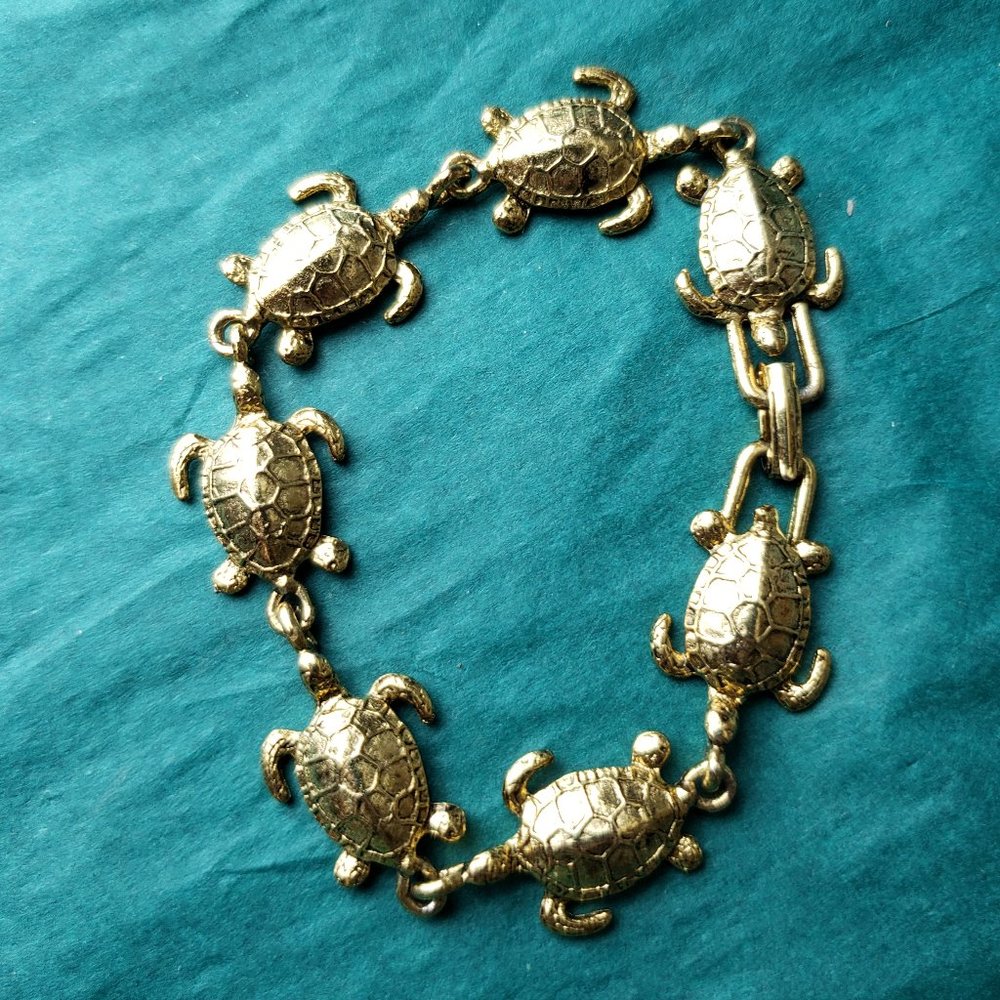 2/10$ gold tone turtle bracelet